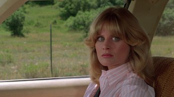 Movie still from “Vacation” (1983), directed by Harold Ramis – A woman sitting in the passenger seat of a car; Close Up shot, Over the shoulder angle
