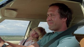 Movie still from “Vacation” (1983), directed by Harold Ramis – A man and a woman sitting in a car; Close Up shot, Low angle
