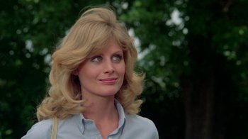 Movie still from “Vacation” (1983), directed by Harold Ramis – A person with long hair; Close Up shot, Low angle