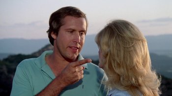 Movie still from “Vacation” (1983), directed by Harold Ramis – A man and a woman talking to each other; Close Up shot, Over the shoulder angle