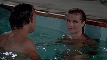 Movie still from “Vacation” (1983), directed by Harold Ramis – A man and a woman in a swimming pool; Medium shot, Over the shoulder angle