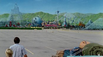 Movie still from “Vacation” (1983), directed by Harold Ramis – An empty parking lot in front of an amusement park; Extreme Wide shot, High angle