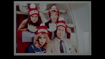 Movie still from “Vacation” (1983), directed by Harold Ramis – A man and two children wearing red hats; Close Up shot, Overhead angle
