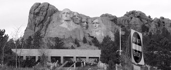 Movie still from “Nebraska” (2013), directed by Alexander Payne – A black - and - white photo of the faces on mount rushmore; Extreme Wide shot, Low angle