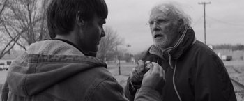 Movie still from “Nebraska” (2013), directed by Alexander Payne – An older man and a younger man looking at each other; Close Up shot, Over the shoulder angle