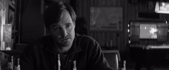 Movie still from “Nebraska” (2013), directed by Alexander Payne – Black and white photograph of a man sitting at a table; Close Up shot, Over the shoulder angle