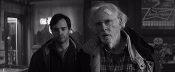Movie still from “Nebraska” (2013), directed by Alexander Payne – A man with bandages all over his face and a man with a bandage on his head; Close Up shot, Over the shoulder angle