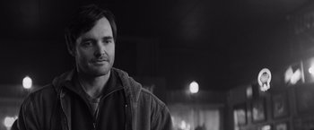 Movie still from “Nebraska” (2013), directed by Alexander Payne – Black and white photograph of a man in a hooded jacket; Close Up shot, Over the shoulder angle