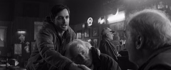 Movie still from “Nebraska” (2013), directed by Alexander Payne – A man is holding a man's head while another man looks on; Close Up shot, Over the shoulder angle