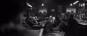 Movie still from “Nebraska” (2013), directed by Alexander Payne – A group of people sitting at a table in a room; Wide shot, Over the shoulder angle