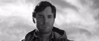 Movie still from “Nebraska” (2013), directed by Alexander Payne – Black and white photograph of a man with a frowning face; Close Up shot, Low angle