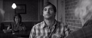 Movie still from “Nebraska” (2013), directed by Alexander Payne – Black and white photograph of a man in a plaid shirt; Close Up shot, Low angle