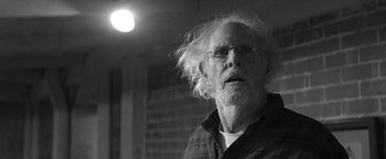 Movie still from “Nebraska” (2013), directed by Alexander Payne – An older man with a beard and glasses; Close Up shot, Low angle