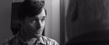 Movie still from “Nebraska” (2013), directed by Alexander Payne – Black and white photograph of a man looking into a mirror; Close Up shot, Over the shoulder angle