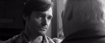 Movie still from “Nebraska” (2013), directed by Alexander Payne – A black and white photo of a man looking at himself in the mirror; Close Up shot, Over the shoulder angle