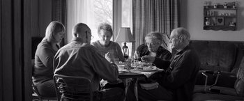Movie still from “Nebraska” (2013), directed by Alexander Payne – A group of people sitting around a table; Medium shot, High angle