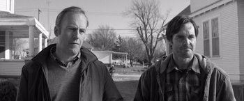 Movie still from “Nebraska” (2013), directed by Alexander Payne – Two men standing next to each other on a field; Close Up shot, Low angle
