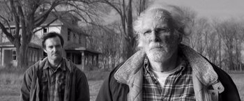 Movie still from “Nebraska” (2013), directed by Alexander Payne – An old man with a beard and a plaid jacket; Close Up shot, Over the shoulder angle