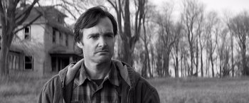 Movie still from “Nebraska” (2013), directed by Alexander Payne – Black and white photograph of a man in a plaid shirt; Close Up shot, Low angle