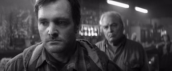 Movie still from “Nebraska” (2013), directed by Alexander Payne – Two men are standing next to each other; Close Up shot, Low angle
