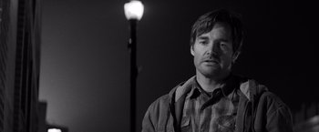 Movie still from “Nebraska” (2013), directed by Alexander Payne – Black and white photograph of a man standing next to a street light; Close Up shot, Low angle
