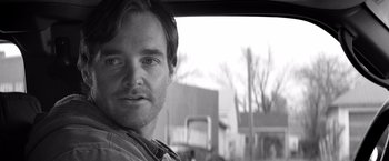 Movie still from “Nebraska” (2013), directed by Alexander Payne – Black and white photograph of a man looking out the window of a car; Close Up shot, Over the shoulder angle