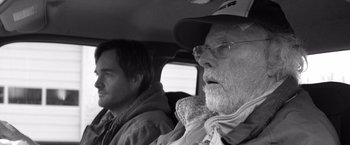 Movie still from “Nebraska” (2013), directed by Alexander Payne – A man and a man sitting in the back of a car; Close Up shot, Over the shoulder angle