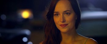 Movie still from “Need for Speed” (2014), directed by Scott Waugh – A person with long hair; Close Up shot, Over the shoulder angle