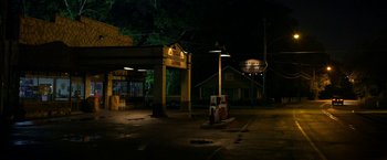 Movie still from “Need for Speed” (2014), directed by Scott Waugh – An empty parking lot at night with lights on; Extreme Wide shot, Low angle