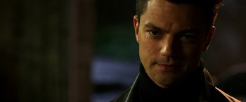 Movie still from “Need for Speed” (2014), directed by Scott Waugh – A person wearing a black jacket; Close Up shot, Over the shoulder angle