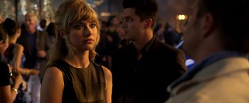 Movie still from “Need for Speed” (2014), directed by Scott Waugh – A man and a woman standing next to each other; Close Up shot, Over the shoulder angle