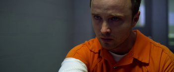 Movie still from “Need for Speed” (2014), directed by Scott Waugh – A person wearing an orange shirt; Close Up shot, Over the shoulder angle