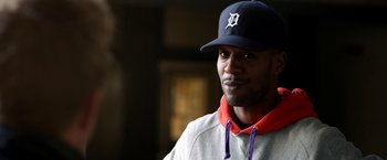 Movie still from “Need for Speed” (2014), directed by Scott Waugh – A person wearing a hat; Close Up shot, Over the shoulder angle