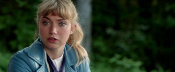 Movie still from “Need for Speed” (2014), directed by Scott Waugh – A person wearing a blue jacket; Close Up shot, Over the shoulder angle