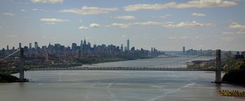 Movie still from “Need for Speed” (2014), directed by Scott Waugh – A view of a city from across the water; Extreme Wide shot, High angle