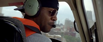 Movie still from “Need for Speed” (2014), directed by Scott Waugh – A person in a helicopter; Close Up shot, Over the shoulder angle