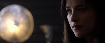 Movie still from “Need for Speed” (2014), directed by Scott Waugh – A woman's face in the dark; Close Up shot, Over the shoulder angle