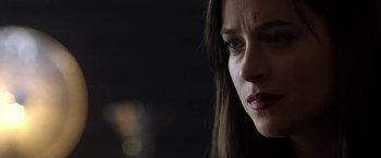 Movie still from “Need for Speed” (2014), directed by Scott Waugh – A woman's face in the dark; Close Up shot, Low angle
