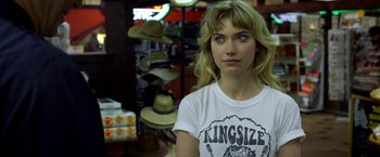 Movie still from “Need for Speed” (2014), directed by Scott Waugh – A woman with blonde hair wearing a t - shirt; Close Up shot, Over the shoulder angle