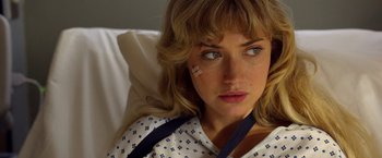 Movie still from “Need for Speed” (2014), directed by Scott Waugh – A woman with bandage on her face in a hospital bed; Close Up shot, Over the shoulder angle