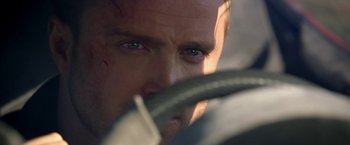 Movie still from “Need for Speed” (2014), directed by Scott Waugh – A person with a knife in his mouth; Extreme Close Up shot, Over the shoulder angle