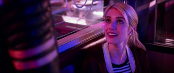 Movie still from “Nerve” (2016), directed by Henry Joost – A beautiful young lady sitting in a booth; Close Up shot, Over the shoulder angle