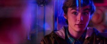 Movie still from “Nerve” (2016), directed by Henry Joost – A young man is looking into the distance; Close Up shot, Over the shoulder angle