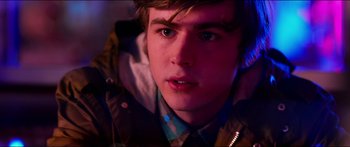 Movie still from “Nerve” (2016), directed by Henry Joost – A person wearing a jacket; Close Up shot, Over the shoulder angle