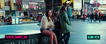 Movie still from “Nerve” (2016), directed by Henry Joost – A woman sitting on top of a bench next to two other people; Wide shot, Over the shoulder angle