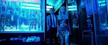 Movie still from “Nerve” (2016), directed by Henry Joost – A man and a woman standing next to each other in front of a building; Medium shot, Low angle