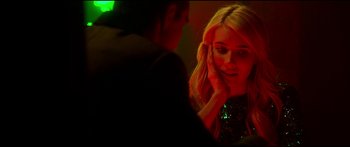 Movie still from “Nerve” (2016), directed by Henry Joost – A young blonde woman is looking at a man in a green shirt; Close Up shot, Over the shoulder angle