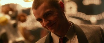 Movie still from “Nerve” (2016), directed by Henry Joost – A person wearing a suit and tie; Close Up shot, Over the shoulder angle