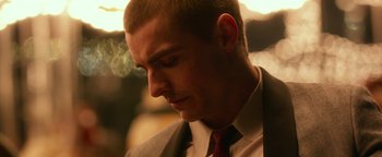 Movie still from “Nerve” (2016), directed by Henry Joost – A person wearing a suit and tie; Close Up shot, Over the shoulder angle