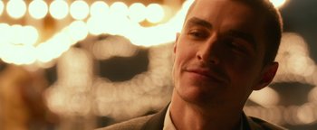 Movie still from “Nerve” (2016), directed by Henry Joost – A person wearing a suit and tie; Close Up shot, Low angle